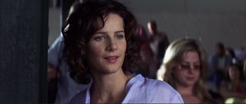 Movie still from “The Rookie” (2002), directed by John Lee Hancock – A person wearing a white shirt; Close Up shot, Over the shoulder angle