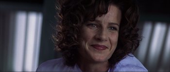 Movie still from “The Rookie” (2002), directed by John Lee Hancock – A person with curly brown hair; Close Up shot, Low angle