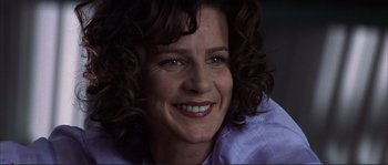 Movie still from “The Rookie” (2002), directed by John Lee Hancock – A person with curly hair smiling; Close Up shot, Low angle