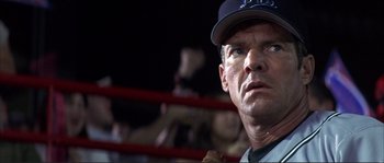Movie still from “The Rookie” (2002), directed by John Lee Hancock – A person wearing a baseball cap; Close Up shot, Low angle
