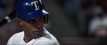 Movie still from “The Rookie” (2002), directed by John Lee Hancock – A baseball player wearing a helmet; Close Up shot, Over the shoulder angle