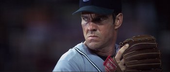 Movie still from “The Rookie” (2002), directed by John Lee Hancock – A baseball player holding a bat; Close Up shot, Low angle