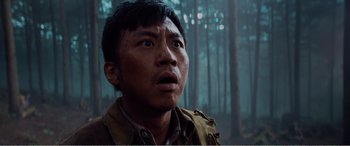 Movie still from “The Sacrifice” (2020), directed by Yang Lu – A person looking up at the sky; Close Up shot, Low angle