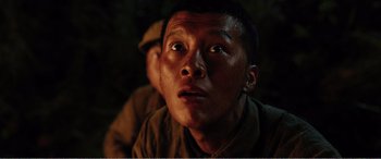 Movie still from “The Sacrifice” (2020), directed by Yang Lu – A person looking up at the sky; Close Up shot, Low angle