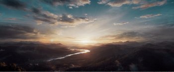 Movie still from “The Sacrifice” (2020), directed by Yang Lu – The sun is setting over a river and mountains; Extreme Wide shot, High angle