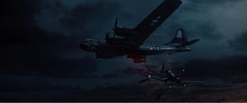 Movie still from “The Sacrifice” (2020), directed by Yang Lu – An airplane is flying in the sky at night; Extreme Wide shot, Low angle