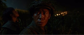 Movie still from “The Sacrifice” (2020), directed by Yang Lu – A man wearing a military uniform and a hat; Close Up shot, Over the shoulder angle
