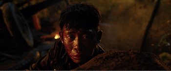 Movie still from “The Sacrifice” (2020), directed by Yang Lu – A young man with blood all over his face; Close Up shot, High angle