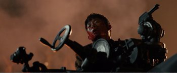 Movie still from “The Sacrifice” (2020), directed by Yang Lu – A man with a bloody face holding a steering wheel; Close Up shot, Low angle