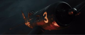 Movie still from “The Sacrifice” (2020), directed by Yang Lu – An old fighter plane with the number 3 painted on it; Wide shot, Overhead angle