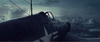 Movie still from “The Sacrifice” (2020), directed by Yang Lu – An old fighter plane is sitting in the water; Wide shot, High angle