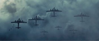Movie still from “The Sacrifice” (2020), directed by Yang Lu – A group of planes flying through the sky; Extreme Wide shot, Low angle