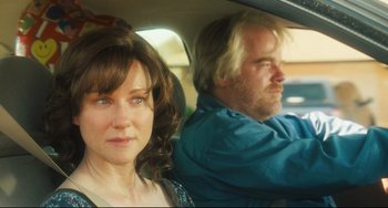 Movie still from “The Savages” (2007), directed by Tamara Jenkins – A woman and a man sitting in the back seat of a car; Close Up shot, Over the shoulder angle