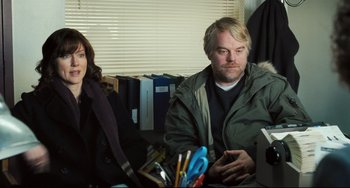 Movie still from “The Savages” (2007), directed by Tamara Jenkins – A man and a woman sitting in front of a computer; Medium shot, Over the shoulder angle