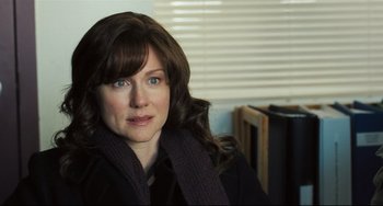 Movie still from “The Savages” (2007), directed by Tamara Jenkins – A person wearing a scarf; Close Up shot, Over the shoulder angle