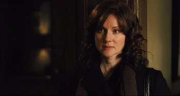 Movie still from “The Savages” (2007), directed by Tamara Jenkins – A person with curly hair; Close Up shot, Over the shoulder angle