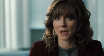 Movie still from “The Savages” (2007), directed by Tamara Jenkins – A person wearing a red jacket; Close Up shot, Over the shoulder angle