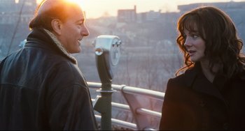 Movie still from “The Savages” (2007), directed by Tamara Jenkins – A man and a woman are standing next to each other; Medium shot, Over the shoulder angle