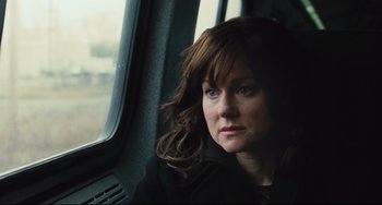 Movie still from “The Savages” (2007), directed by Tamara Jenkins – A person looking out a window; Close Up shot, Over the shoulder angle