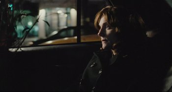 Movie still from “The Savages” (2007), directed by Tamara Jenkins – A woman sitting in a car looking out the window; Close Up shot, Over the shoulder angle