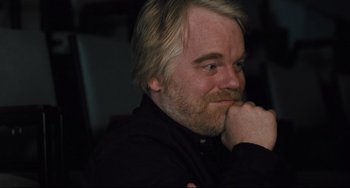 Movie still from “The Savages” (2007), directed by Tamara Jenkins – A person with a hand on his chin; Close Up shot, Over the shoulder angle