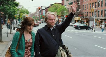 Movie still from “The Savages” (2007), directed by Tamara Jenkins – A man and a woman walking down a street; Medium shot, Low angle