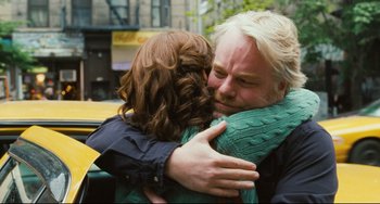 Movie still from “The Savages” (2007), directed by Tamara Jenkins – A man and a woman hugging each other outside; Close Up shot, Over the shoulder angle