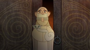 Movie still from “The Secret of Kells” (2009), directed by Nora Twomey – An animated figure of a man holding a cat in his arms; Close Up shot, Low angle