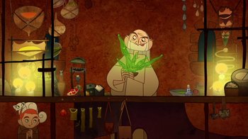 Movie still from “The Secret of Kells” (2009), directed by Nora Twomey – An old man holding a plant in his hands; Medium shot, Overhead angle