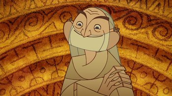 Movie still from “The Secret of Kells” (2009), directed by Nora Twomey – An old man with long hair and a beard is smiling for the camera; Close Up shot, Over the shoulder angle