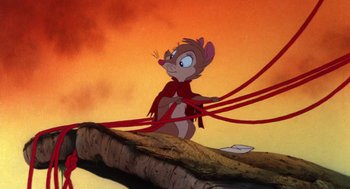 Movie still from “The Secret of NIMH” (1982), directed by Don Bluth – A mouse that is standing on a log; Wide shot, Low angle