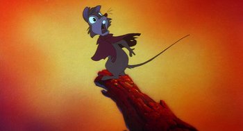 Movie still from “The Secret of NIMH” (1982), directed by Don Bluth – A cartoon of a mouse that is on fire; Medium shot, Low angle