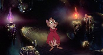 Movie still from “The Secret of NIMH” (1982), directed by Don Bluth – A mouse that is standing in the dirt; Wide shot, High angle