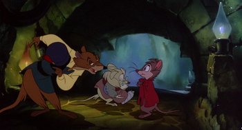 Movie still from “The Secret of NIMH” (1982), directed by Don Bluth – A group of three mice standing next to each other in a cave; Medium shot, Over the shoulder angle