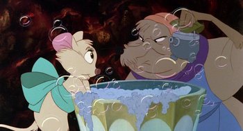 Movie still from “The Secret of NIMH” (1982), directed by Don Bluth – A couple of people that are looking at something; Medium shot, High angle