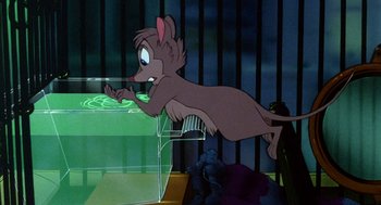 Movie still from “The Secret of NIMH” (1982), directed by Don Bluth – A mouse is jumping in the air over a cage; Wide shot, High angle