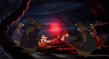 Movie still from “The Secret of NIMH” (1982), directed by Don Bluth – A group of people standing next to each other in a room; Wide shot, High angle