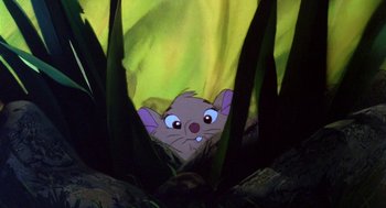 Movie still from “The Secret of NIMH” (1982), directed by Don Bluth – A mouse peeking out from behind a plant; Wide shot, Low angle