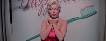 Movie still from “The Seven Year Itch” (1955), directed by Billy Wilder – A wax statue of marilyn monroe is shown; Close Up shot, Low angle