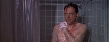 Movie still from “The Seven Year Itch” (1955), directed by Billy Wilder – A man in the shower with soap on his face; Medium shot, Over the shoulder angle