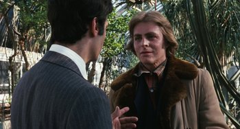 Movie still from “The Seven-Ups” (1973), directed by Philip D'Antoni – A man talking to another man in front of a tree; Close Up shot, Over the shoulder angle