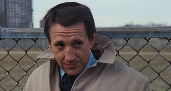 Movie still from “The Seven-Ups” (1973), directed by Philip D'Antoni – A person wearing a jacket; Close Up shot, Over the shoulder angle