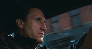 Movie still from “The Seven-Ups” (1973), directed by Philip D'Antoni – A person in a car looking out the window; Close Up shot, Low angle