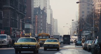 Movie still from “The Seven-Ups” (1973), directed by Philip D'Antoni – A city street filled with lots of traffic; Extreme Wide shot, Low angle