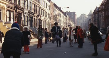 Movie still from “The Seven-Ups” (1973), directed by Philip D'Antoni – A group of people standing on the side of the street; Wide shot, High angle