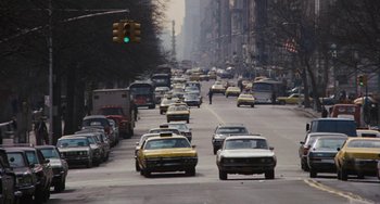 Movie still from “The Seven-Ups” (1973), directed by Philip D'Antoni – A street filled with lots of cars and traffic lights on it; Extreme Wide shot, High angle