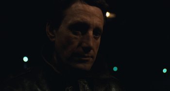 Movie still from “The Seven-Ups” (1973), directed by Philip D'Antoni – A person wearing a leather jacket; Close Up shot, Over the shoulder angle