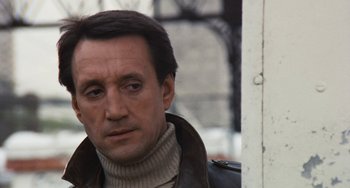 Movie still from “The Seven-Ups” (1973), directed by Philip D'Antoni – A person wearing a jacket; Close Up shot, Low angle