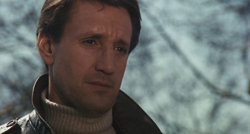 Movie still from “The Seven-Ups” (1973), directed by Philip D'Antoni – A person wearing a jacket; Close Up shot, Low angle