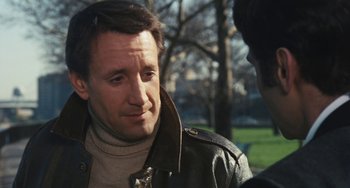 Movie still from “The Seven-Ups” (1973), directed by Philip D'Antoni – A person talking to another person; Close Up shot, Over the shoulder angle